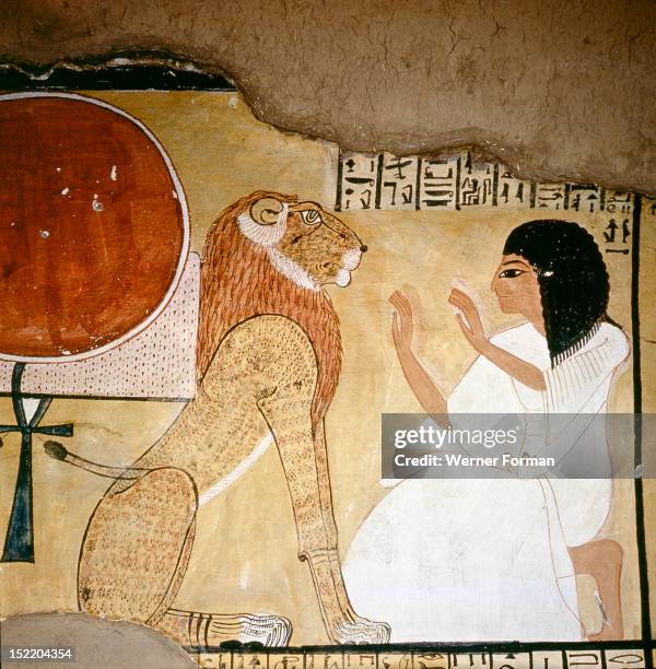 Detail of a painting in the tomb of Inherkha, The deceased prays in front of a god of the Underworld, in his lion form. Lions were the symbols of the...