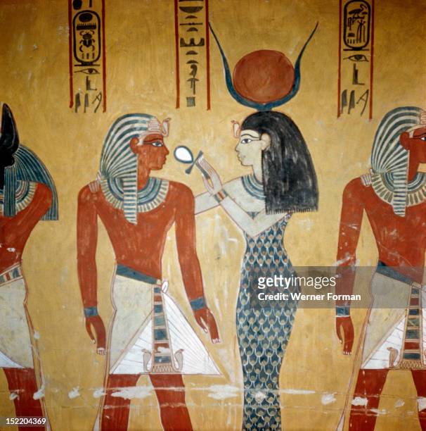 Detail of a wall painting in the tomb of Tuthmosis 1V, Hathor/Isis offers the ankh sign of life to the pharaoh. Egypt. Ancient Egyptian. 18th dynasty...