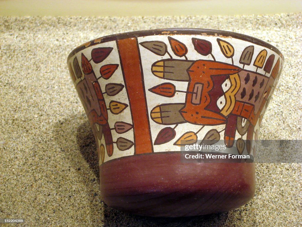 Polychrome ceramic kero showing the mythical spotted cat creature
