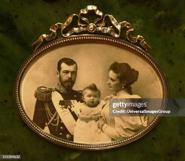 Picture Frame. Silver, enamel, wood painted to imitate snakewood; Silver-gilt, enamel. Photo of Tsar Nicholas and his wife Alexandra with the...