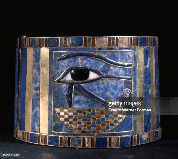 One of a pair of bracelets found on Shoshenq IIs body with representations of the Wedjat eye upon a basket, The eyes are depictions of the eyes of...