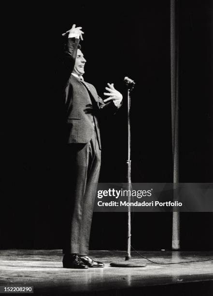 The French singer and composer Gilbert Bécaud performing on stage. 1959