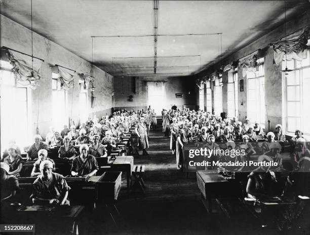 Some Italian female factory workers dealing packing cigars at the Manifattura Tabacchi. Florence, 1920s