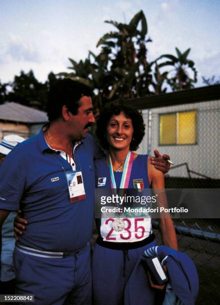 The Italian high jumper Sara Simeoni smiling with her husband the trainer Erminio Azzaro at Los Angeles Olympics. Los Angeles, 1984