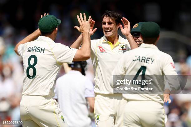 Australia captain Pat Cummins celebrates with Mitchell Marsh and Alex Carey dismissing Moeen Ali of England during Day Two of the LV= Insurance Ashes...