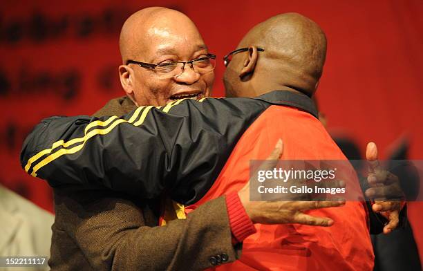 President Jacob Zuma embraces Cosatu President Sdumo Dlamini during Cosatu's 11th National Conference at Gallagher Estate on September 17, 2012 in...