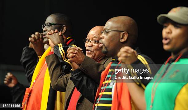 President Jacob Zuma, Cosatu General Secretary Zwelinzima Vavi, Cosatu President Sdumo Dlamini and Cosatu Deputy President Zingisa Losi attend the...