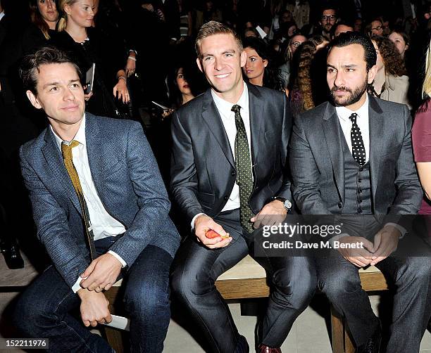 Julian Ovenden, Pete Reed and Saif Ali Khan attend the Burberry Spring Summer 2013 Womenswear Show Front Row at Kensington Gardens on September 17,...