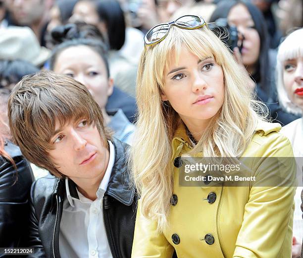 Miles Kane and Suki Waterhouse attend the Burberry Spring Summer 2013 Womenswear Show Front Row at Kensington Gardens on September 17, 2012 in...