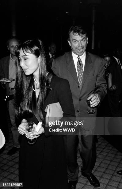 Noriko Watanabe and Sam Neill attend an event at the Uptown Theater in Washington, D.C., on June 9, 1993.