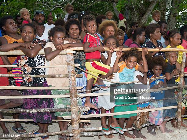 Crowds wait to greet Prince William, Duke of Cambridge and Catherine, Duchess of Cambridge their visit to Tuvanipupu Island on their Diamond Jubilee...