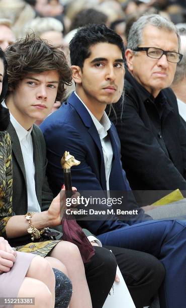 Harry Styles, Dev Patel and Mario Testino attend the Burberry Spring Summer 2013 Womenswear Show Front Row at Kensington Gardens on September 17,...