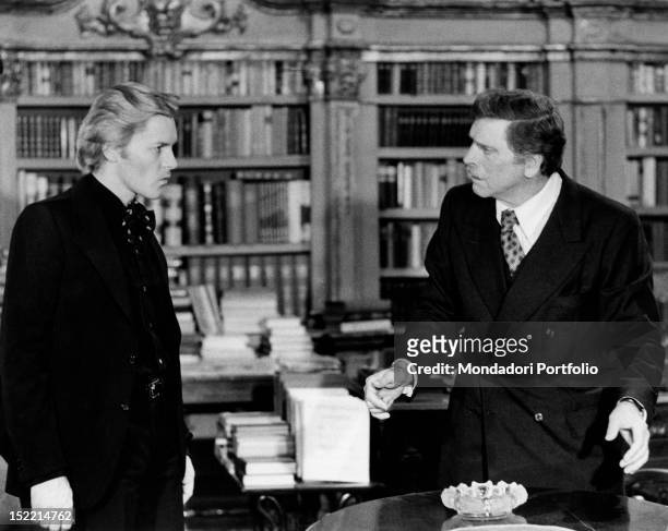 Austrian actor Helmut Berger and American actor Burt Lancaster acting in the film 'Conversation Piece'. Rome, 1974
