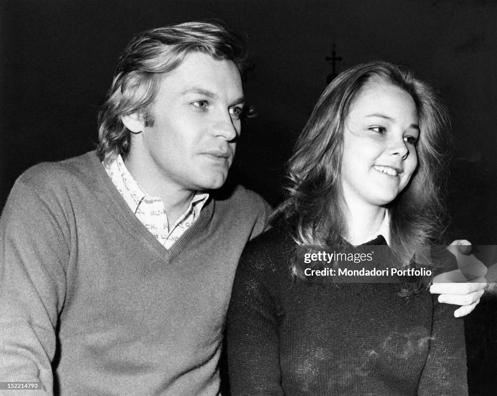 Helmut Berger hugging Claudia Marsani