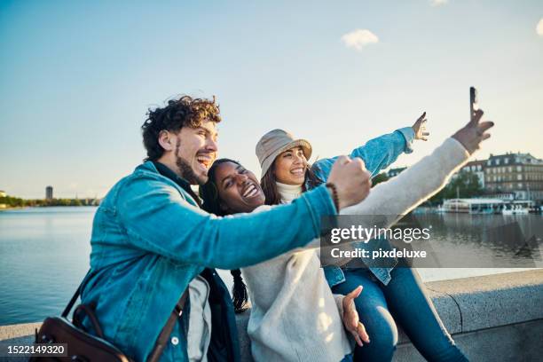 better together: group of multi-ethnic friends enjoying their time in the city of copenhagen - tourist group stock pictures, royalty-free photos & images