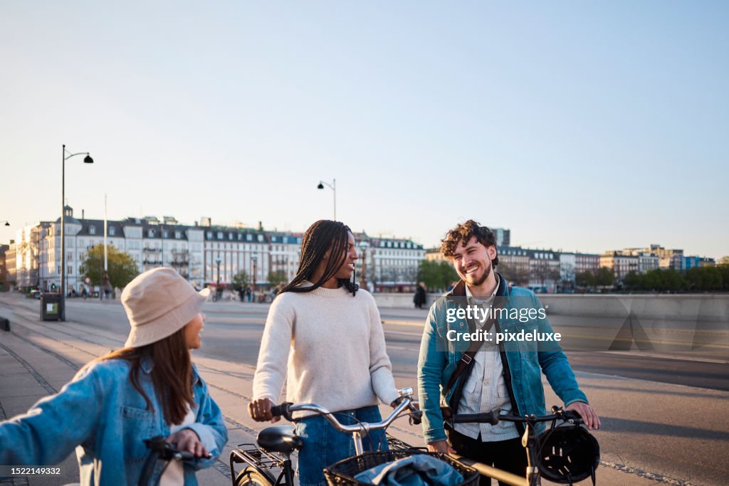 Cityscape Connection: Multi-Ethnic Friends Create Memorable Moments through Cycling