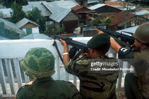 Three snipers of the South Vietnam coalition checking the military region during the battle in June. Saigon , 1968.