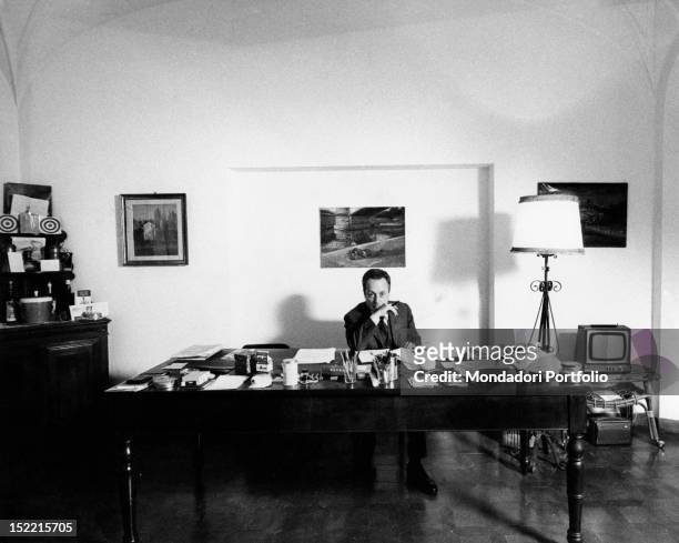 Writer Giorgio Bassani in the office of his Roman house. Rome, 1969.