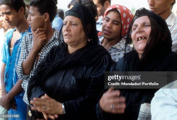 Women and guys crying disperate for the loss of Sadat President, assassinated on October 6 by a terrorist. Medinet Nasr , .