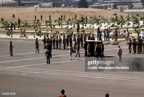 The coffin of Egyptian President Sadat, assassinated by a terrorist on October 6, is carried on shoulder by high politic officers. Medinet Nasr , .
