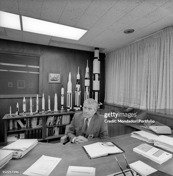 The scientist and aerospace engineer Wernher von Braun, leading figure in the development of rocket technology in USA, in his NASA office; on his...