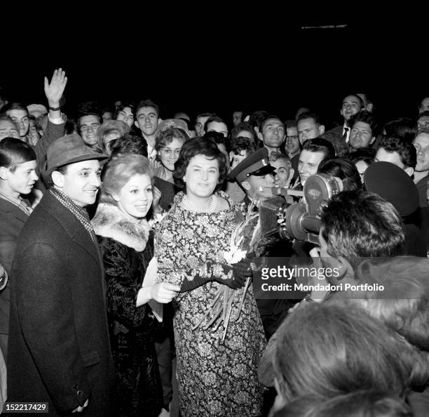 Bruno Prevedi, Mirella Freni and Fiorenza Cossotto surrounded by spectators outside the theatre, at the end of the performance of 'Turandot'. Bolshoi...