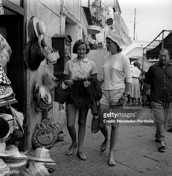 The Swedish actress Ingrid Bergman walking with her daughter Pia Lindstrom. Capri, the 50s.
