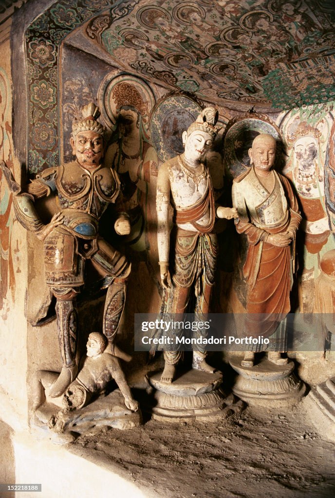 The statues of devarajas, a Bodhisattva and apostle Buddha Ananda in a Chinese temple