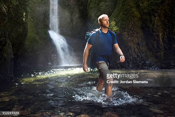 a man hiking a narrow canyon. - oneonta falls bildbanksfoton och bilder