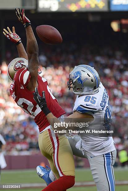 Carlos Rogers of the San Francisco 49ers breaks up a pass to Tony Scheffler of the Detroit Lions in the first quarter of an NFL football game at...