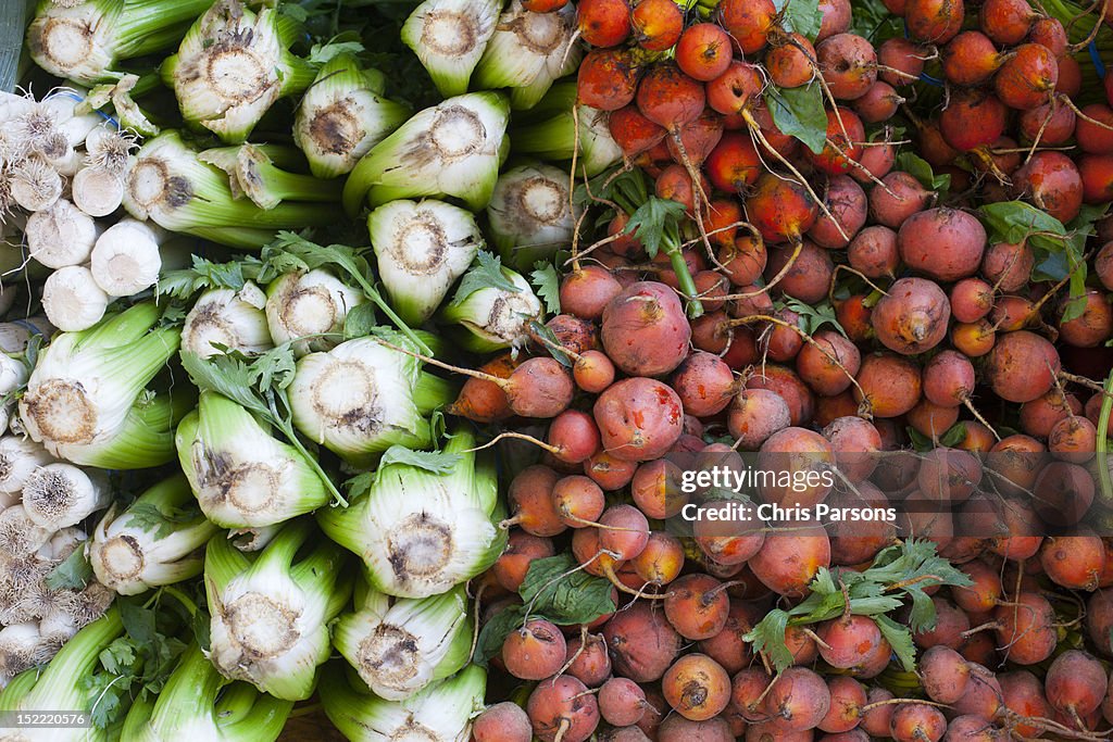 Stack of vegetables at farmers market.