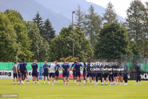 Players of FC Schalke 04 form a circle during the FC Schalke 04 Training Session on July 10, 2023 in Mittersill, Austria.