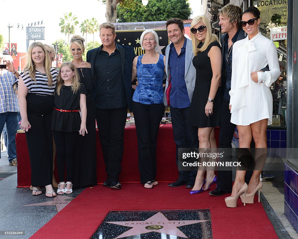 US-ENTERTAINMENT-RASCAL FLATTS-HOLLYWOOD WALK OF FAME STAR