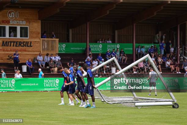 Assan Quedraogo of FC Schalke 04, Niklas Tauer of FC Schalke 04, Malik Talabidi of FC Schalke 04 and Verthomy Boboy of FC Schalke 04 carry the goal...