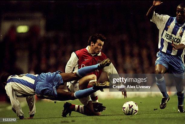 Fredrik Ljungberg of Arsenal and Djalminha of Deportivo La Coruna battle for control during the UEFA Cup fourth round first leg game played at...