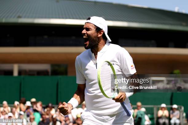 Matteo Berrettini of Italy celebrates winning match point against Alex De Minaur of Australia in the Men's Singles second round match during day five...