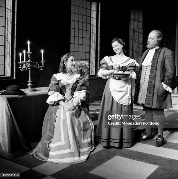 Scene of 'Tartuffe' by Molière, performed in the Manzoni Theatre: the actress Isa Barzizza is sat down and is smiling to Lilla Brignone , under the...