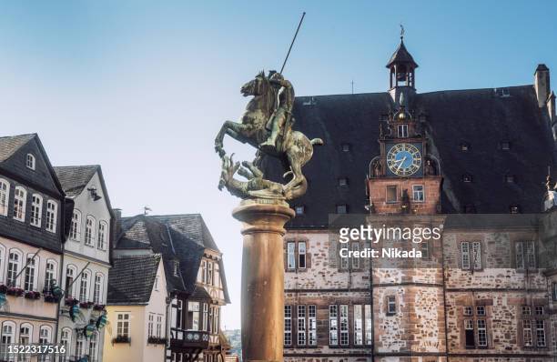 town hall and market square in marburg, germany - marburg germany stock pictures, royalty-free photos & images