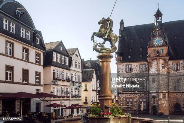 historic building of town hall and market square in marburg, germany - marburg germany stock pictures, royalty-free photos & images