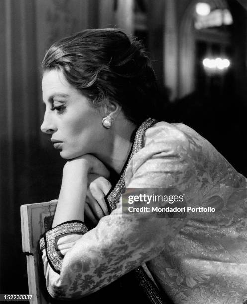 French actress and model Capucine posing in a hotel. Rome, 1962