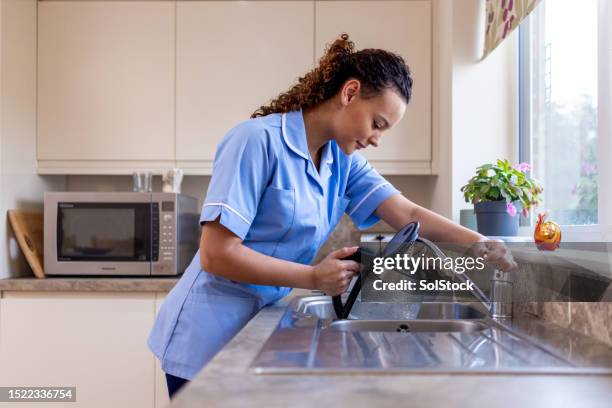 making a cup of tea for patient - kettle stock pictures, royalty-free photos & images