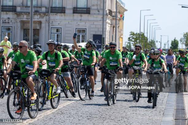 Participants seen touring the main streets of the historical center of Lisbon during the cycling event. The World Bike Tour event, held in the...
