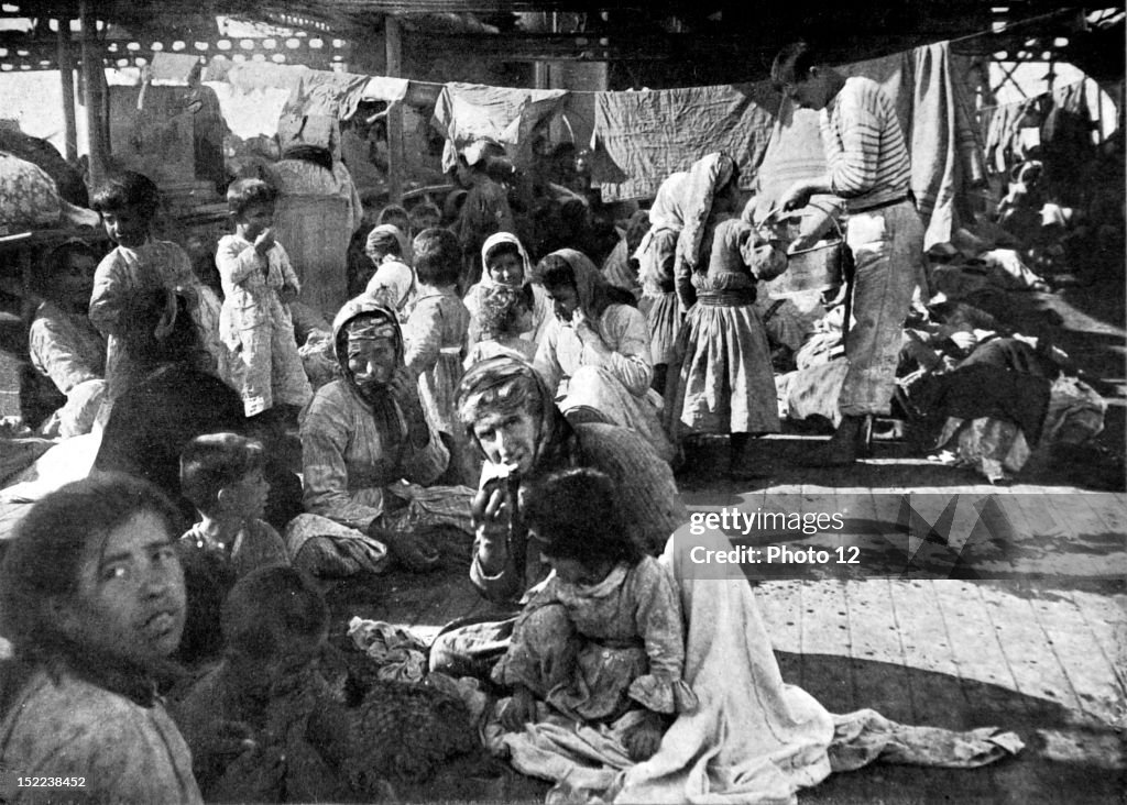 1915, World War I, The massacre of the Armenian populations in Turkey, an encampment of Armenian refugees on the deck of a French cruiser that rescued them.