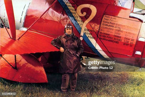 France French pilote Dieudonne Coste posing next to the aircraft 'Le Point d'Interrogation', a plane for long-distance raids, that has established...