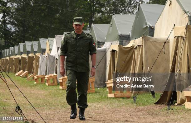 Belarusian soldier walks through a newly-built camp on a site previously used by the Belarusian army that could potentially accommodate up to 5,000...