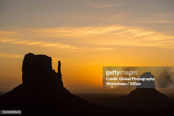 silhouette of rock formations against sky during sunset,monument valley,utah,united states,usa - utah stock pictures, royalty-free photos & images