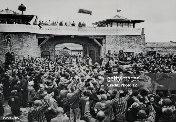 Mauthausen concentration camp was liberated, shortly before the end of the war in Europe, Here, liberated prisoners offer a rousing welcome to...