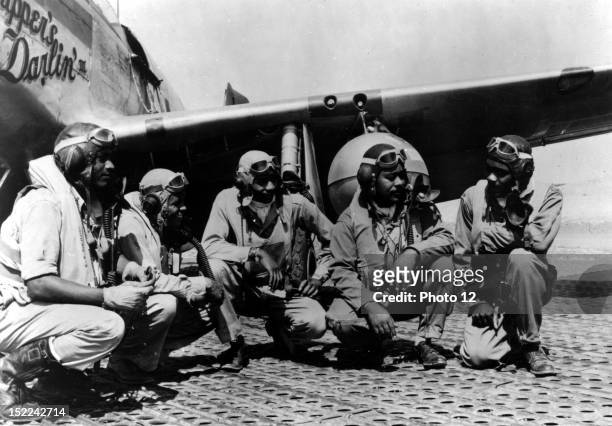 Black pilots of a P-51 Mustang group of the 15th, US Air Force based in Italy 'shoot the breeze' before taking off on another escort mission against...