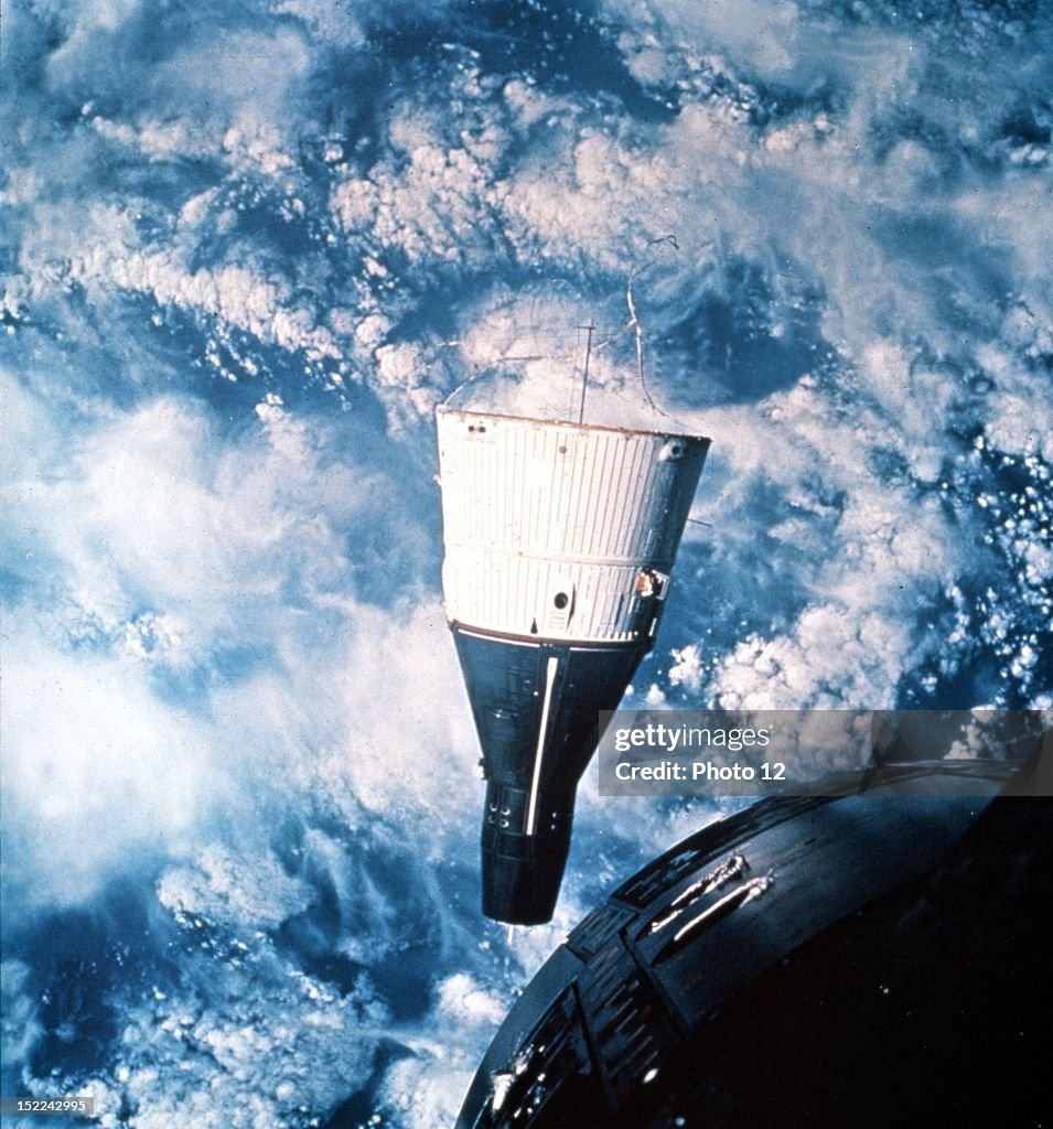 Gemini 7 spacecraft photographies through the Gemini 6 spacecraft hatch window in Earth orbit