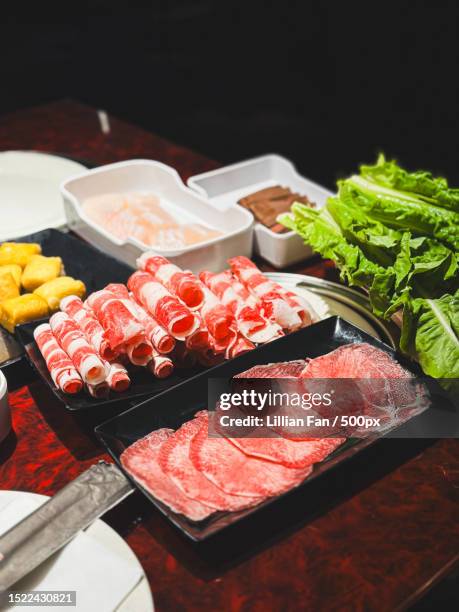 high angle view of meat on table,new york,united states,usa - sukiyaki stock-fotos und bilder